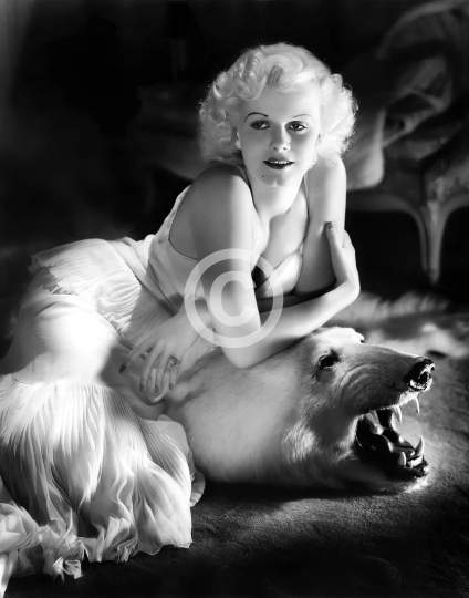 Jean Harlow on bearskin rug, studio portrait ca. 1936